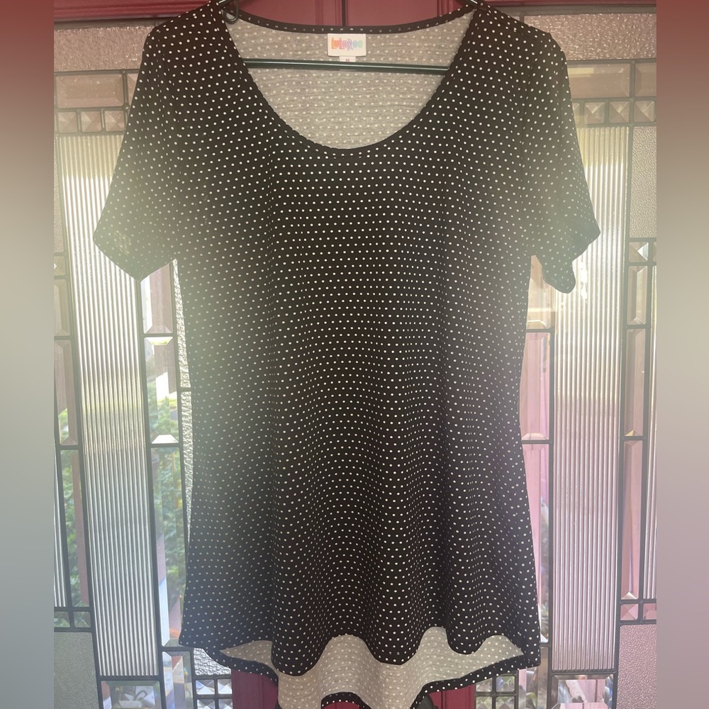 LuLaRoe black and white polka dotted shirt.